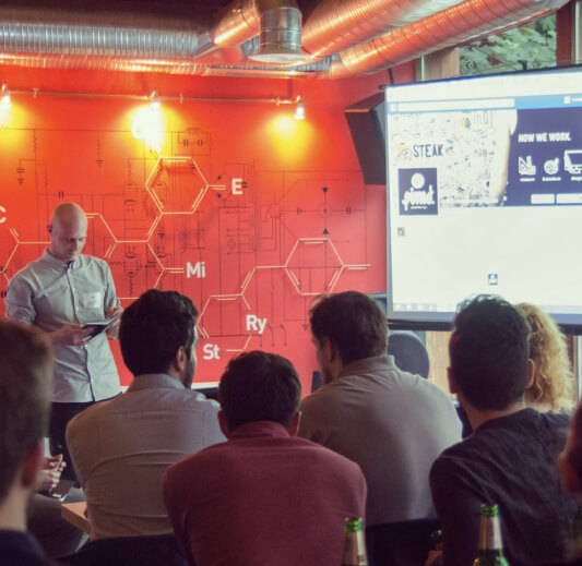 A Creative Mingle speaker presenting to seated participants